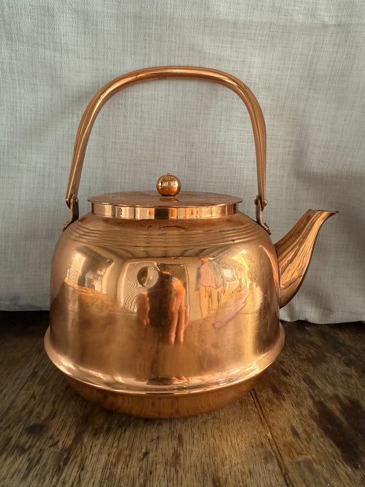 Vintage copper kettle with polished finish, farmhouse style teapot for rustic kitchen décor.